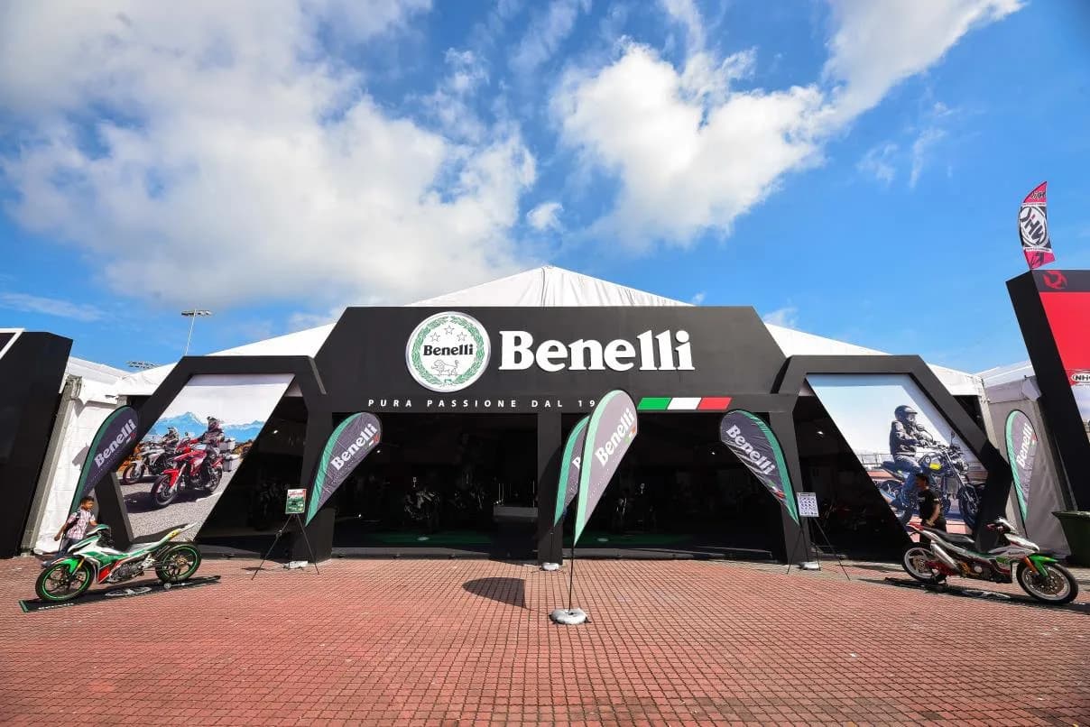 Benelli: Benelli event pavilion with large branded facade and motorcycle displays — actual site photograph
