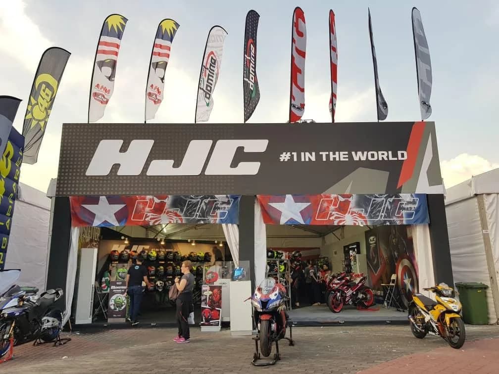 HJC Helmets: HJC event entrance with overhead branding and promotional flags — actual site photograph