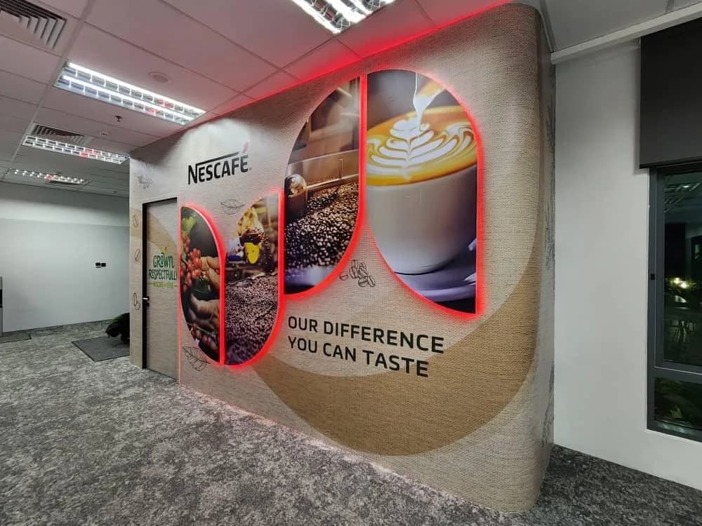 Nestlé HQ: Curved Nescafé printed feature wall in the office — actual site photograph