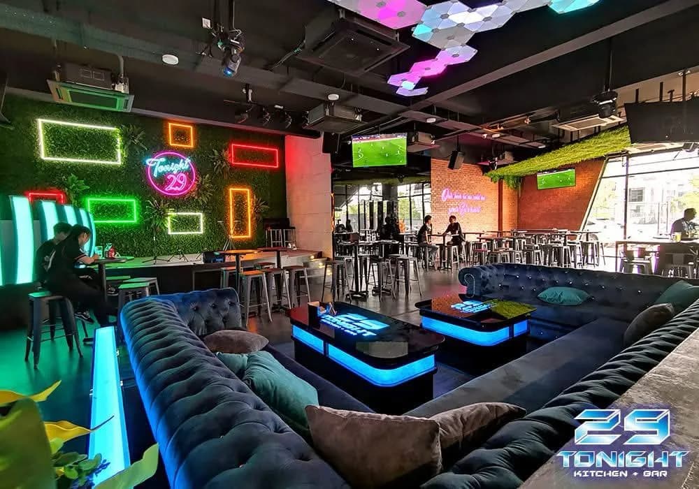Tonight Restaurant & Bar: Lounge seating framed by neon wall panels — actual site photograph